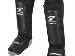 ESPINILLERA NEGRA ZEBRA PERFORMANCE ELÁSTICA