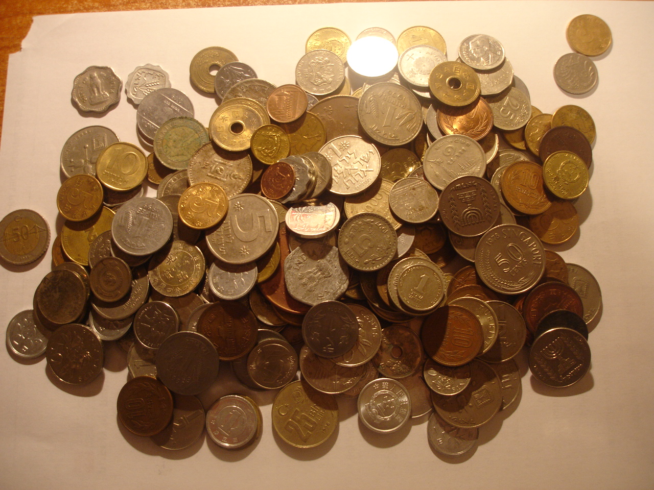 Monedas mundiales al peso por continentes